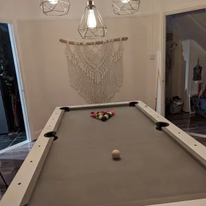 Pool table that doubles as dining and table tennis
