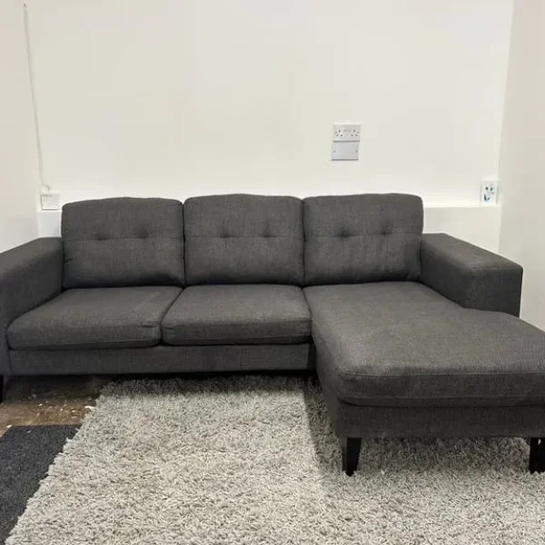 Grey L shape sofa with reversible chaise