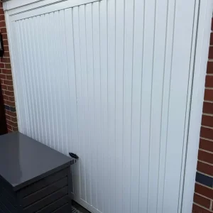 Up and over white single garage door and frame with side locks