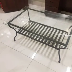 Glass and metal coffee table with modern legs