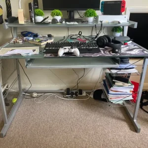 Desk with three work surfaces