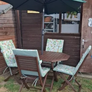 Wooden garden table with 4 chairs and parasol with new cushions - Image 2