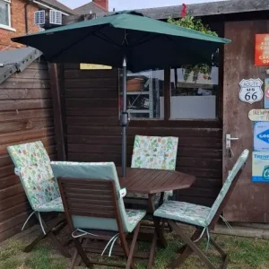 Wooden garden table with 4 chairs and parasol with new cushions