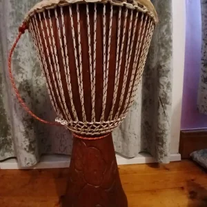 Djembe drum with elephant carving