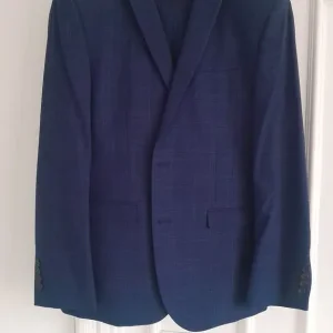 Man's blue checked suit