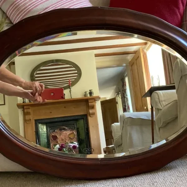 Victorian/Edwardian oval wall mirror with bevelled glass