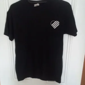 T Shirt - Size Medium