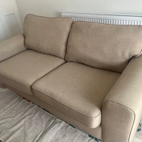 Comfy beige three-seater sofa