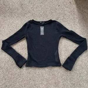 Women’s Black Ribbed Long Sleeved Top
