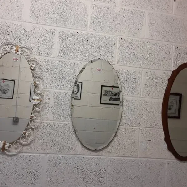 Vintage oval mirrors, one with white metal frame
