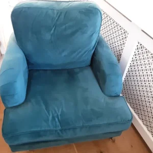Teal velvet armchair with castors