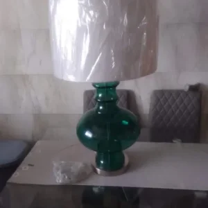 green lamp with white shade