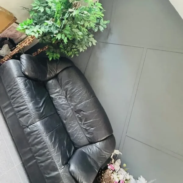 Black leather 2-seater sofa