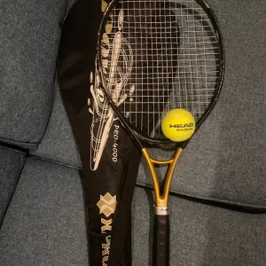 Xpro tennis racquet with cover and ball