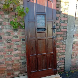 SOLID OAK FRONT DOOR WITH ARTS IRON DETAILS