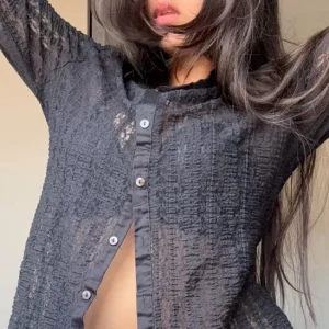 Black lace blouse with ruffles and long sleeves