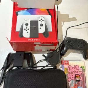Nintendo Switch OLED 128GB with Pro Controller and 3 Games
