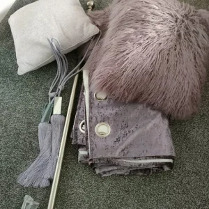 Curtains and curtain pole with cushions and tie backs