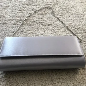 Matching silver satin shoes and clutch - Image 7
