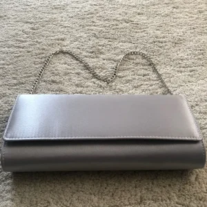 Matching silver satin shoes and clutch - Image 8