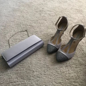 Matching silver satin shoes and clutch