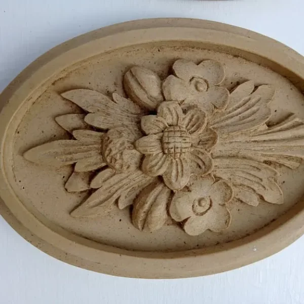 Pair of decorative oval rosettes for fire surround