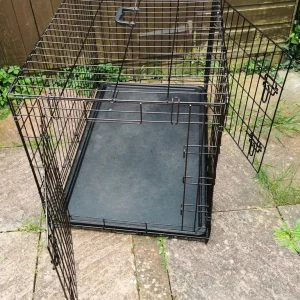 LARGE BLACK STEEL DOG CAGE FOR SALE (Approximate dimensions L. 36 W. 24 H. 25 inches)