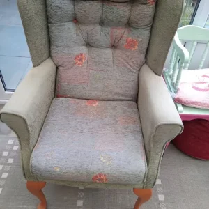 Two winged back green chairs ,at £50.00 each.