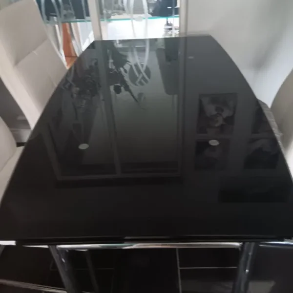 Extendable black glass dining table