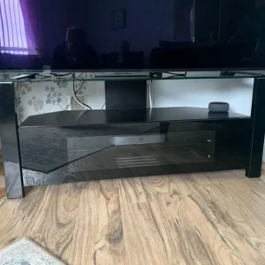 Television stand in black with glass top