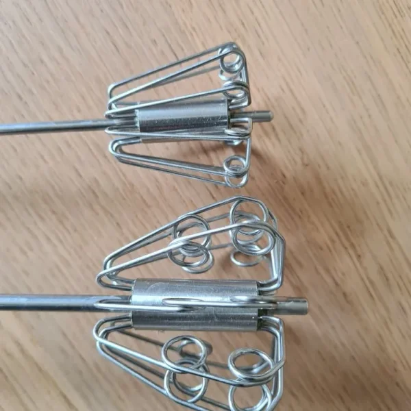 Pair of hand held push whisks