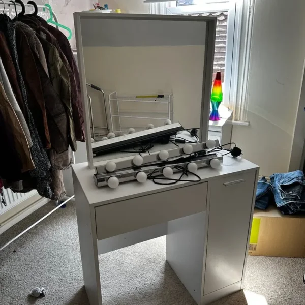 Vanity table, mirror and two lights