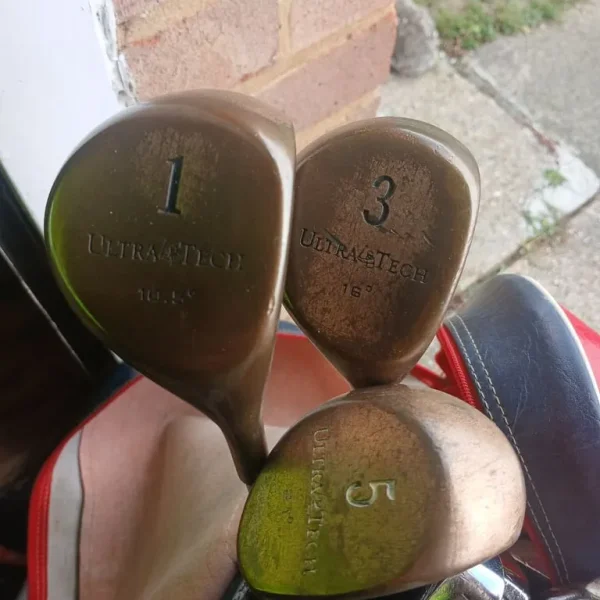 Spalding golf bag with Dunlop clubs and assorted gear