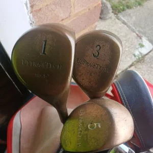 Spalding golf bag with Dunlop clubs and assorted gear