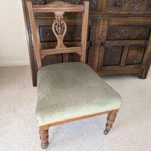 Small vintage wooden upholstered chair