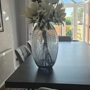 Large silver vase with flower display