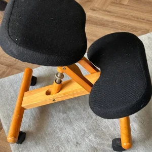 Ergonomic kneeling chair with angled seat and foam cushions