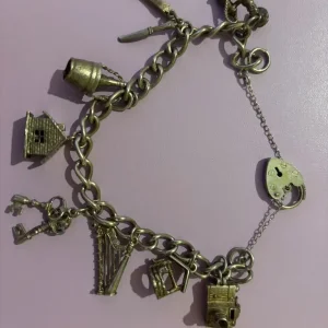 Vintage silver hallmark charm bracelet with 8 charms, 7" London 1979 - Image 2