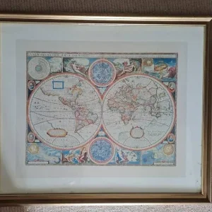 Large world map in gold frame