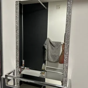 Silver glitter bathroom mirror with shelf and accessories