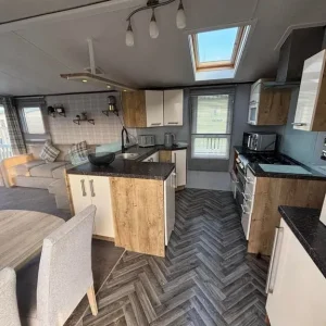 2010 Willerby Scenic 3-bedroom static caravan with hottub and wrap-around decking - Image 2