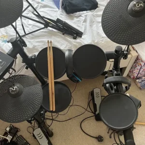Yamaha Electric Drum Set with Fender Amp and Drumsticks