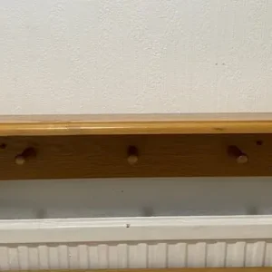 Aspace solid wood wall shelf with hangers