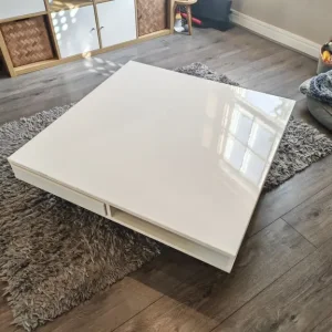 Large white coffee table with chrome legs