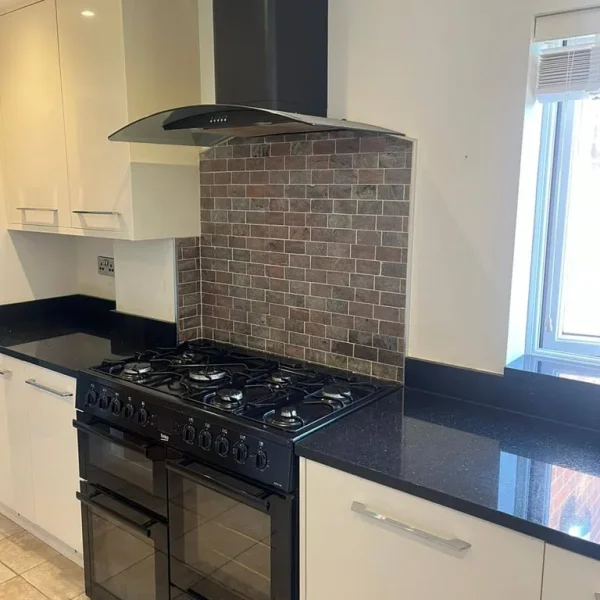 Full kitchen with granite worktops and integrated dishwasher