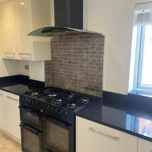 Full kitchen with granite worktops and integrated dishwasher