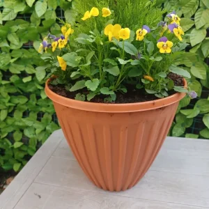 Large plastic planter with plants - Image 3
