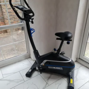 Roger Black on stand exercise bike - Image 2