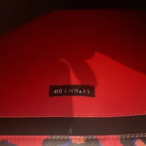 Skinnydip London “Oh Honey” Red Leopard Print Tote