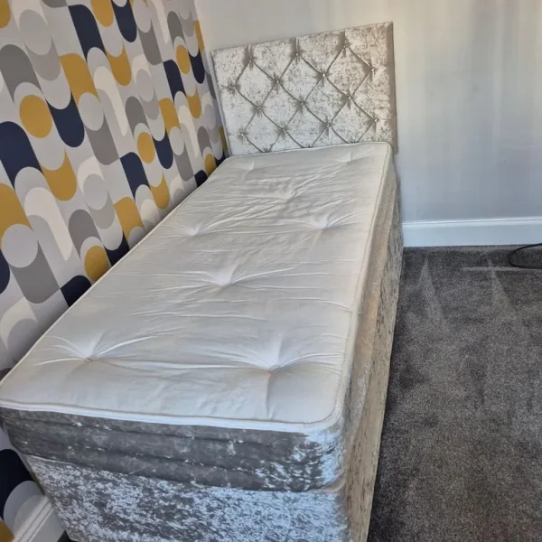 Single bed with mattress and headboard